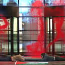 Activists from Palestine Action lock themselves together outside the Thales' London headquarters