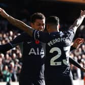 Brennan Johnson (L) celebrates with Tottenham Hotspur's Spanish defender #23 Pedro Porro (R) after scoring the opening goal of the English Premier League football match 