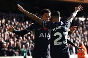 Brennan Johnson (L) celebrates with Tottenham Hotspur's Spanish defender #23 Pedro Porro (R) after scoring the opening goal of the English Premier League football match 