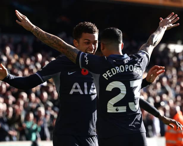 Brennan Johnson (L) celebrates with Tottenham Hotspur's Spanish defender #23 Pedro Porro (R) after scoring the opening goal of the English Premier League football match 