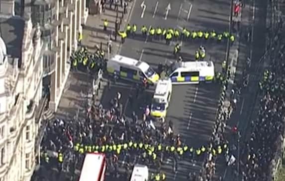 Officers have detained a large group of counter protestors in Bridge Street on Armistice Day. (Photo by MPS) 