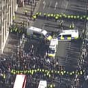 Officers have detained a large group of counter protestors in Bridge Street on Armistice Day. (Photo by MPS) 