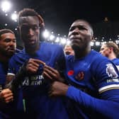 Nicolas Jackson of Chelsea celebrates with teammates Reece James (L) and Moises Caicedo of Chelsea after scoring the team's second goal  during the Premier League match 
