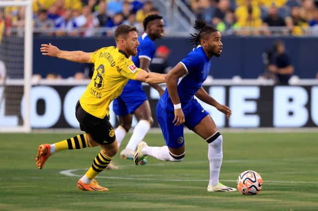 Christopher Nkunku #45 of Chelsea FC controls the ball while defended by Salih Ozcan #6 of Borussia Dortmund during the first half during the pre-season