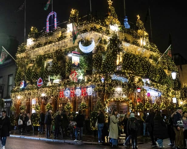 The big switch on of 150,000 LED lights on the 55 Christmas trees on the outside of the Churchill Arms in Kensington, west London. (Photo by Tony Kershaw/SWNS)