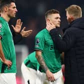  Kieran Trippier of Newcastle United is embraced by Eddie Howe, Manager of Newcastle United following the team's defeat during the Premier League match