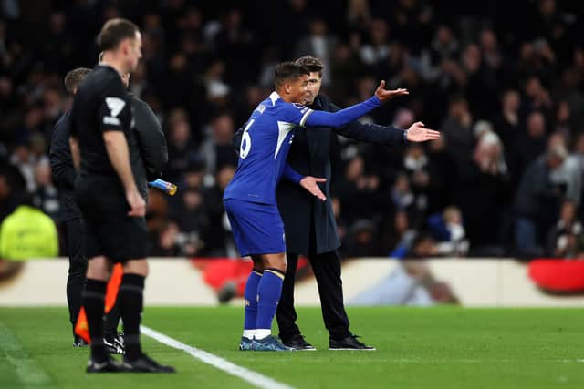 Thiago Silva of Chelsea and Mauricio Pochettino, Manager of Chelsea, interact during the Premier League match