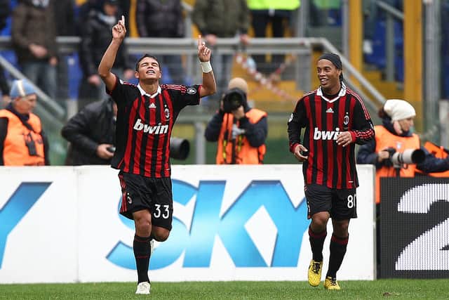 Thiago Silva (L) of AC Milan celebrates with Ronaldinho after scoring the first goal during the Serie A match between SS Lazio and AC Milan