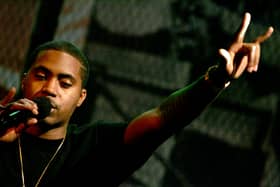 Rapper Nas onstage during MTV's taping of Life and Rhymes of... Nas at the Bowery Poetry Club on December 15, 2004 in New York City. (Photo by Paul Hawthorne/Getty Images)