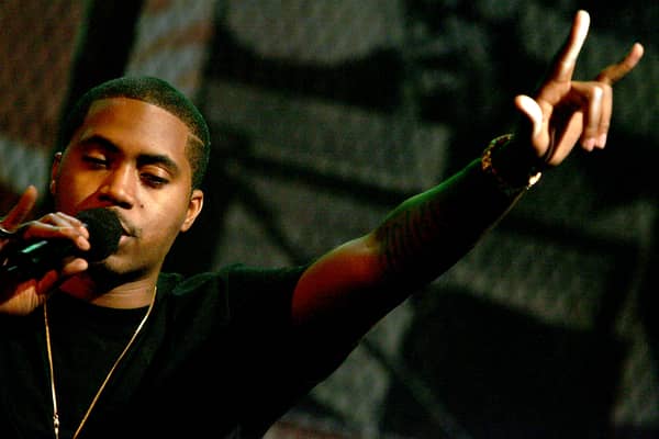 Rapper Nas onstage during MTV's taping of Life and Rhymes of... Nas at the Bowery Poetry Club on December 15, 2004 in New York City. (Photo by Paul Hawthorne/Getty Images)