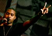 Rapper Nas onstage during MTV's taping of Life and Rhymes of... Nas at the Bowery Poetry Club on December 15, 2004 in New York City. (Photo by Paul Hawthorne/Getty Images)