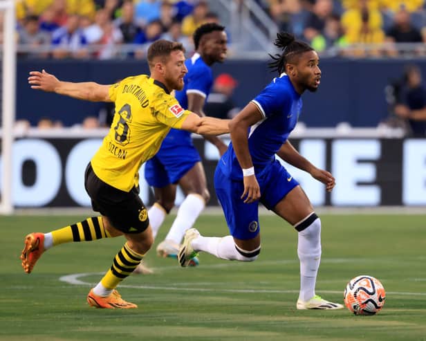 Christopher Nkunku #45 of Chelsea FC controls the ball while defended by Salih Ozcan #6 of Borussia Dortmund 