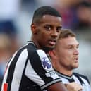 Alexander Isak of Newcastle United celebrates with team mate Kieran Trippier after scoring their sides first goal during the Premier League match 