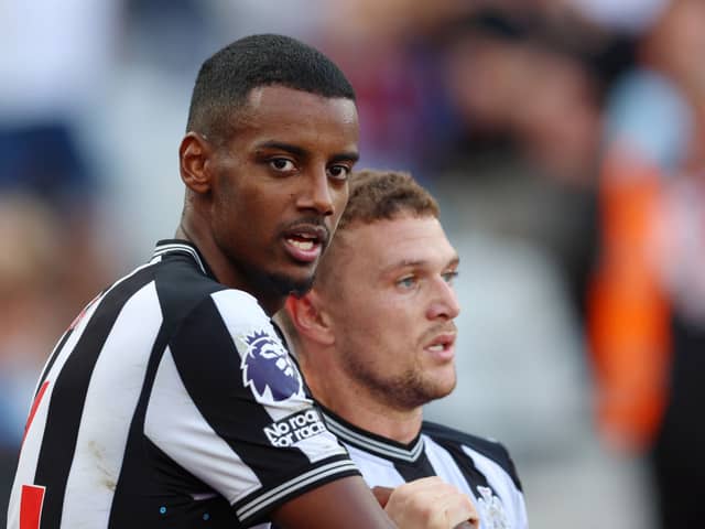 Alexander Isak of Newcastle United celebrates with team mate Kieran Trippier after scoring their sides first goal during the Premier League match 