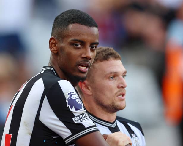 Alexander Isak of Newcastle United celebrates with team mate Kieran Trippier after scoring their sides first goal during the Premier League match 