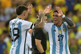 Argentina's defender Nicolas Otamendi (L) celebrates with midfielder Enzo Fernandez after scoring during the 2026 FIFA World Cup South American qualification football match