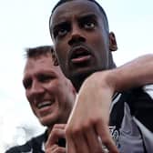  Alexander Isak celebrates with Newcastle United's English defender #33 Dan Burn after scoring the equalising goal during the English Premier League football match 