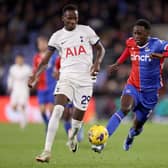 Naouirou Ahamada of Crystal Palace runs with the ball whilst under pressure by Pape Matar Sarr of Tottenham Hotspur 