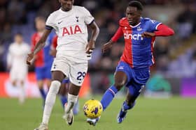 Naouirou Ahamada of Crystal Palace runs with the ball whilst under pressure by Pape Matar Sarr of Tottenham Hotspur 