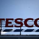 A Tesco sign. (Photo by Daniel Leal/AFP via Getty Images)