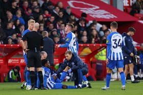  Tariq Lamptey of Brighton & Hove Albion receives medical treatment during the Premier League match between Nottingham Forest and Brighton & Hove Albion