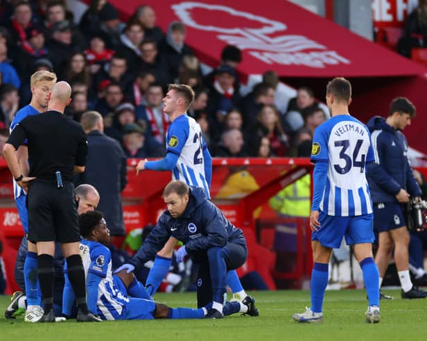  Tariq Lamptey of Brighton & Hove Albion receives medical treatment during the Premier League match between Nottingham Forest and Brighton & Hove Albion