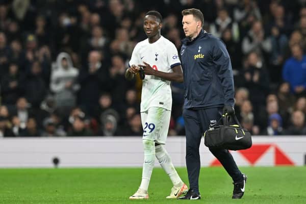 Senegalese midfielder #29 Pape Matar Sarr (C) leaves the game having picked up an injury during the English Premier League football match
