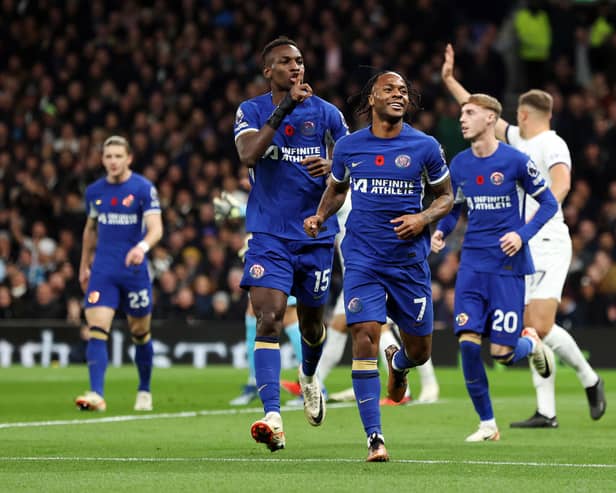 Raheem Sterling of Chelsea celebrates scoring a goal that was later ruled out for handball during the Premier League match between Tottenham Hotspur and Chelsea FC