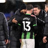 Pascal Gross of Brighton & Hove Albion talks to Mauricio Pochettino, Manager of Chelsea, following the Premier League match between Chelsea FC and Brighton & Hove Albion