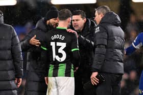 Pascal Gross of Brighton & Hove Albion talks to Mauricio Pochettino, Manager of Chelsea, following the Premier League match between Chelsea FC and Brighton & Hove Albion