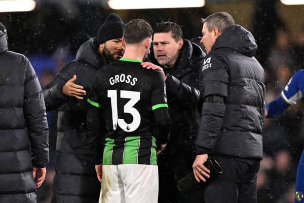 Pascal Gross of Brighton & Hove Albion talks to Mauricio Pochettino, Manager of Chelsea, following the Premier League match between Chelsea FC and Brighton & Hove Albion