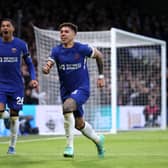 Enzo Fernandez of Chelsea celebrates with teammate Levi Colwill after scoring the team's third goal during the Premier League match between Chelsea FC