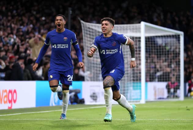 Enzo Fernandez of Chelsea celebrates with teammate Levi Colwill after scoring the team's third goal during the Premier League match between Chelsea FC
