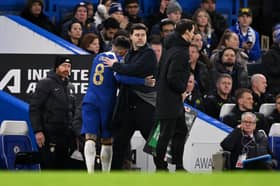 Mauricio Pochettino hugs Enzo Fernandez as he limps off. Credit: Getty