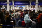 Passengers queue at Eurostar International Departures at St Pancras station