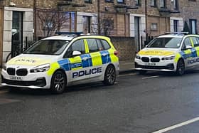 Met Police vehicles. (Photo by André Langlois)
