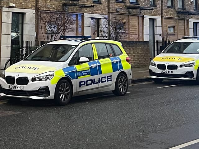 Met Police vehicles. (Photo by André Langlois)