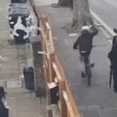 CCTV footage shows a cyclist knocking hats off Jewish men close to a synagogue in Stamford Hill.