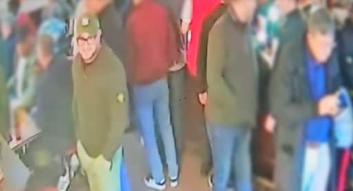 Police urge anyone who recognises the man in green, wearing a hat and glasses, to contact them