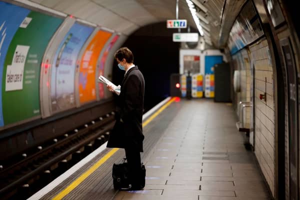 A lone commuter on a Tube platform. (Photo by TOLGA AKMEN/AFP via Getty Images)