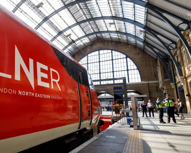 A London North Eastern Railway (LNER) train at King's Cross. (Photo by TOLGA AKMEN/AFP via Getty Images)