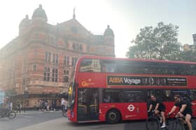 A London bus passes the Palace Theatre in London's West End. (Photo by André Langlois)