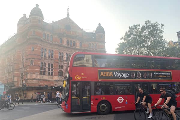 A London bus passes the Palace Theatre in London's West End. (Photo by André Langlois)