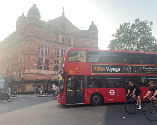 A London bus passes the Palace Theatre in London's West End. (Photo by André Langlois)