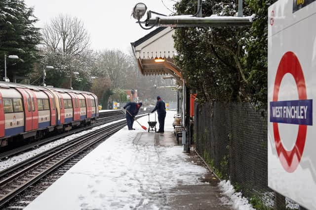 TfL staff clearing the platform at West Finchley