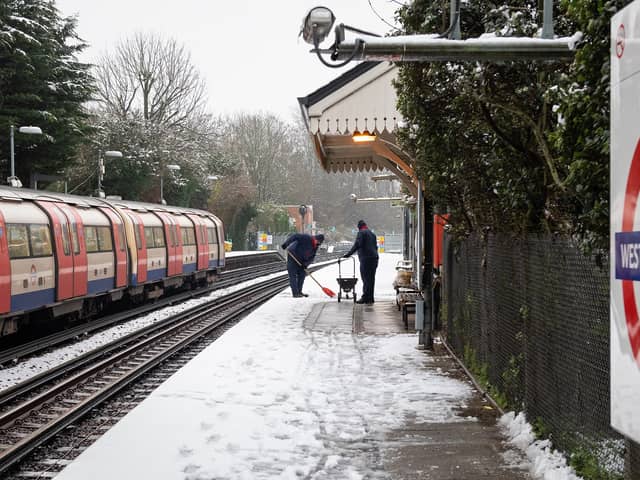 TfL staff clearing the platform at West Finchley
