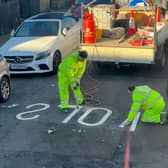 The word 'slow' spelled backwards on a street in Penge, south London,