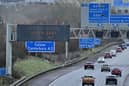 Warnings for strong winds are displayed to traffic using the M25 motorway, near Swanley, south of London on January 21, 2024. Amber warnings for wind were in place in the UK as Storm Isha approached. (Photo by BEN STANSALL/AFP via Getty Images)