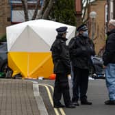 Police and forensics officers work at an address in Southwark where police shot a man dead following calls for help. (Photo by Carl Court/Getty Images)