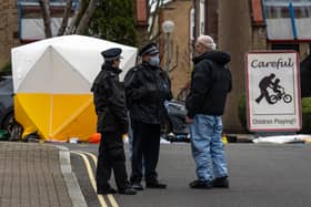 Police and forensics officers work at an address in Southwark where police shot a man dead following calls for help. (Photo by Carl Court/Getty Images)